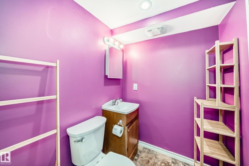 Half bathroom with vanity and toilet - 9823 75 Avenue, Edmonton, AB - Indoor Photo Showing Bathroom