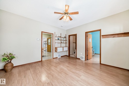 Unfurnished room with light wood-style floors and ceiling fan - 9823 75 Avenue, Edmonton, AB - Indoor Photo Showing Other Room