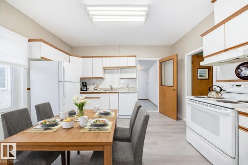 Dining room featuring light wood-style floors - 9823 75 Avenue, Edmonton, AB - Indoor Photo Showing Other Room
