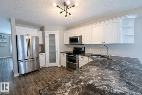 29 Walters Court, Leduc, AB - Indoor Photo Showing Kitchen With Double Sink