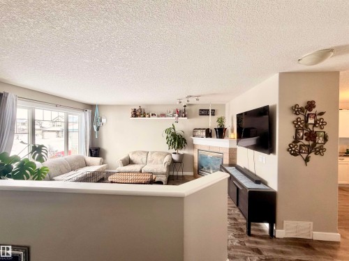 29 Walters Court, Leduc, AB - Indoor Photo Showing Other Room With Fireplace