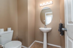 Bathroom featuring baseboards and light tile patterned floors - 