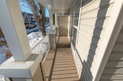 View of snow covered back of property - 