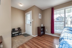 Entryway featuring light wood finished floors and a textured ceiling - 