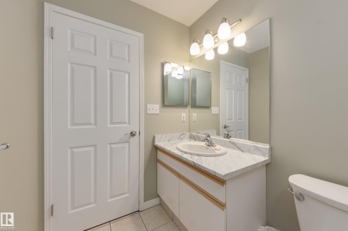 Bathroom with vanity and light tile patterned floors - 9916 178 Avenue, Edmonton, AB - Indoor Photo Showing Bathroom