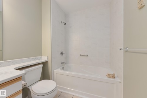 Full bath with vanity, bathtub / shower combination, and light tile patterned floors - 9916 178 Avenue, Edmonton, AB - Indoor Photo Showing Bathroom