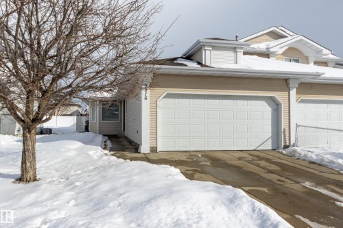 View of front of house featuring concrete driveway and a garage - 9916 178 Avenue, Edmonton, AB - Outdoor