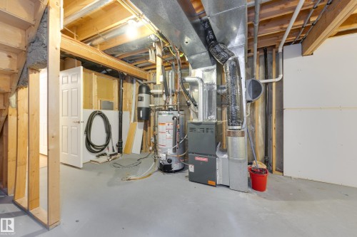 Unfinished below grade area featuring gas water heater and heating unit - 9916 178 Avenue, Edmonton, AB - Indoor Photo Showing Basement