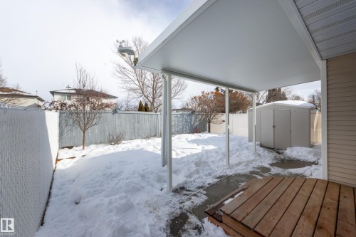 Snowy yard featuring a fenced backyard and a storage shed - 9916 178 Avenue, Edmonton, AB - Outdoor