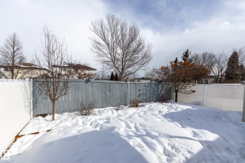 Yard layered in snow featuring a fenced backyard - 9916 178 Avenue, Edmonton, AB - Outdoor