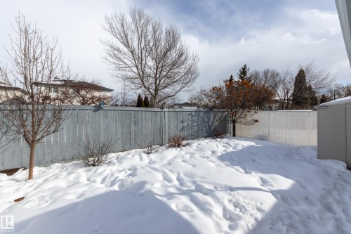 Yard covered in snow featuring a fenced backyard - 9916 178 Avenue, Edmonton, AB - Outdoor
