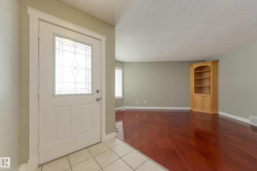 Entrance foyer featuring light tile patterned flooring and a textured ceiling - 9916 178 Avenue, Edmonton, AB - Indoor Photo Showing Other Room
