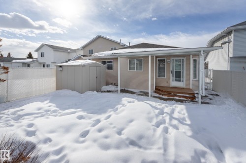 Snow covered house featuring a deck and a shed - 9916 178 Avenue, Edmonton, AB - Outdoor