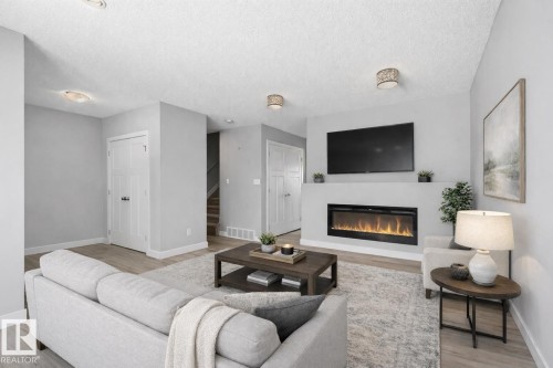 114 Richmond Link, Fort Saskatchewan, AB - Indoor Photo Showing Living Room With Fireplace