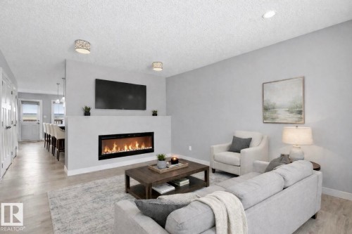114 Richmond Link, Fort Saskatchewan, AB - Indoor Photo Showing Living Room With Fireplace