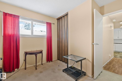 Bedroom featuring light colored carpet and a textured ceiling - 313 Willow Court, Edmonton, AB - Indoor Photo Showing Other Room