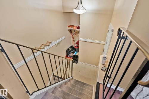 Staircase with tile patterned floors and baseboards - 313 Willow Court, Edmonton, AB - Indoor Photo Showing Other Room