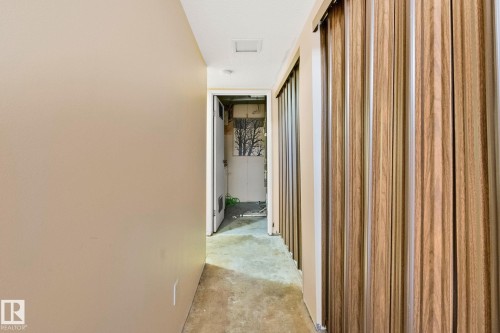 Hall with unfinished concrete flooring - 313 Willow Court, Edmonton, AB - Indoor Photo Showing Other Room