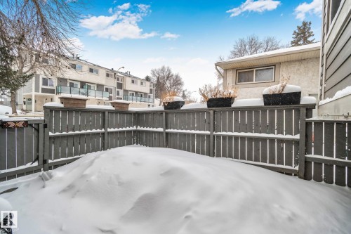 Snow covered patio with a residential view - 313 Willow Court, Edmonton, AB - Outdoor