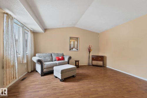 Living room with wood finished floors and baseboards - 313 Willow Court, Edmonton, AB - Indoor