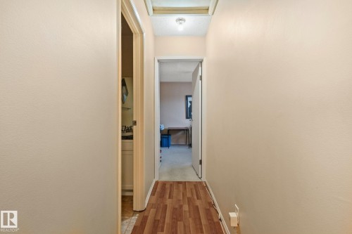 Hallway featuring light wood-style flooring and baseboards - 313 Willow Court, Edmonton, AB - Indoor Photo Showing Other Room