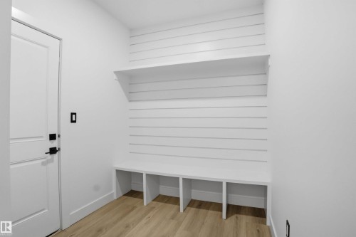 Mudroom with light wood-style floors and baseboards - 15415 20 Street, Edmonton, AB - Indoor Photo Showing Other Room