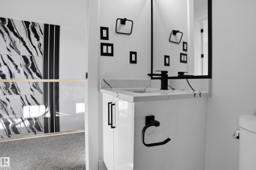 Half bathroom with toilet and vanity - 15415 20 Street, Edmonton, AB - 