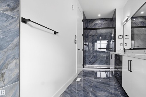 Full bathroom with vanity, dark marble finish floors, a marble finish shower, wine cooler, and recessed lighting - 15415 20 Street, Edmonton, AB - Indoor Photo Showing Other Room