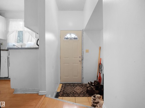 Entrance foyer featuring light tile patterned floors - 17122 96 Street, Edmonton, AB - Indoor Photo Showing Other Room