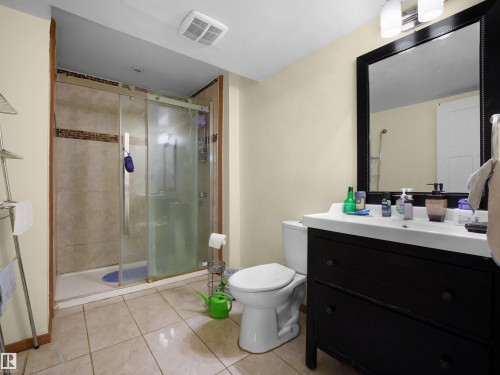 Bathroom with vanity, a stall shower, and light tile patterned floors - 17122 96 Street, Edmonton, AB - Indoor Photo Showing Bathroom