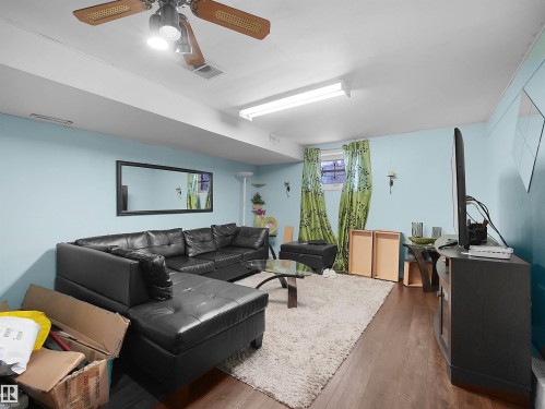 Living area featuring hardwood / wood-style flooring and a ceiling fan - 17122 96 Street, Edmonton, AB - Indoor Photo Showing Living Room