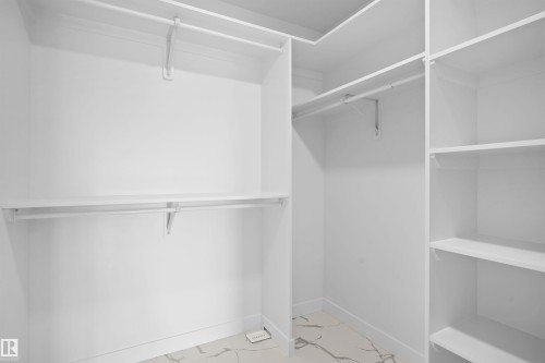 View of walk in closet - 3910 41 Avenue, Beaumont, AB - Indoor With Storage
