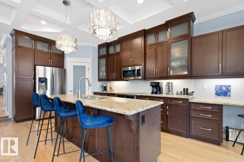 Kitchen With Bar-Style Counter & Island With Sink. - 10216 89 Street, Edmonton, AB - Indoor Photo Showing Kitchen With Double Sink With Upgraded Kitchen