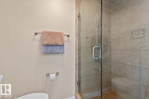 Master Bedroom En-Suite With Toilet And A Glass Shower Stall. - 10216 89 Street, Edmonton, AB - Indoor Photo Showing Bathroom