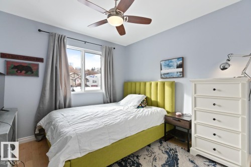 Bedroom featuring a ceiling fan and wood finished floors - 10216 89 Street, Edmonton, AB - Indoor Photo Showing Bedroom