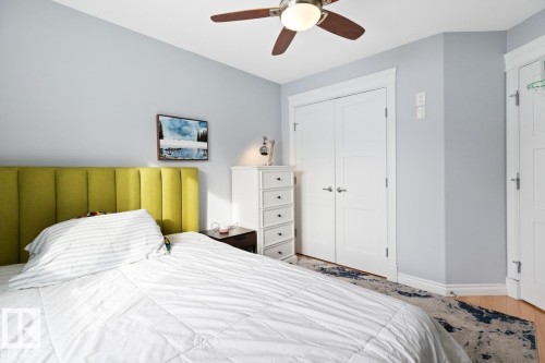 Bedroom with a ceiling fan and a closet - 10216 89 Street, Edmonton, AB - Indoor Photo Showing Bedroom