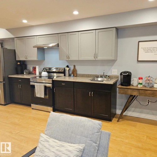 Kitchen In The Basement Featuring Stainless Steel Appliances. - 10216 89 Street, Edmonton, AB - Indoor Photo Showing Kitchen