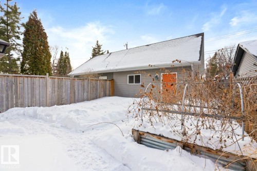 Rear View Of The Property Featuring A Fenced Backyard & A Double Detached Garage. - 10216 89 Street, Edmonton, AB - Outdoor
