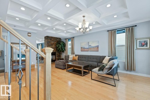 Living Room With Maple Hardwood Floors, Coffered Ceiling & A Healthy Amount Of Natural Light. - 10216 89 Street, Edmonton, AB - Indoor