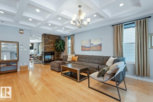 Living Room With A 2-Sided Fireplace. - 10216 89 Street, Edmonton, AB - Indoor Photo Showing Living Room With Fireplace