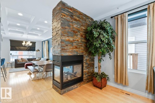 Living Room With View Into Kitchen Area. - 10216 89 Street, Edmonton, AB - Indoor Photo Showing Other Room With Fireplace