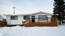 View of front facade with a wooden deck - 1102 55 Street, Edson, AB  - Outdoor With Deck Patio Veranda 