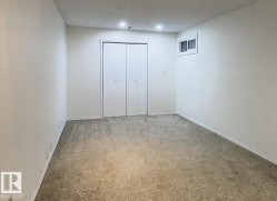 Unfurnished bedroom featuring carpet flooring and a closet - 