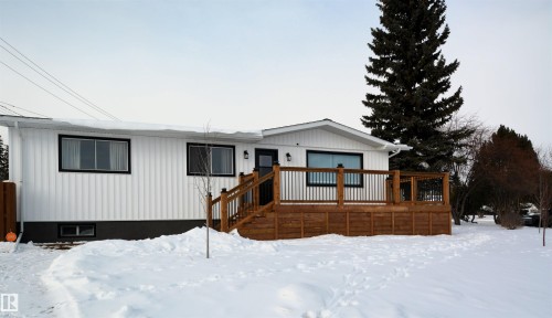 View of front of home featuring a wooden deck - 1102 55 Street, Edson, AB - Outdoor