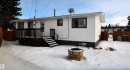 Back of house featuring a wooden deck - 1102 55 Street, Edson, AB  - Outdoor 