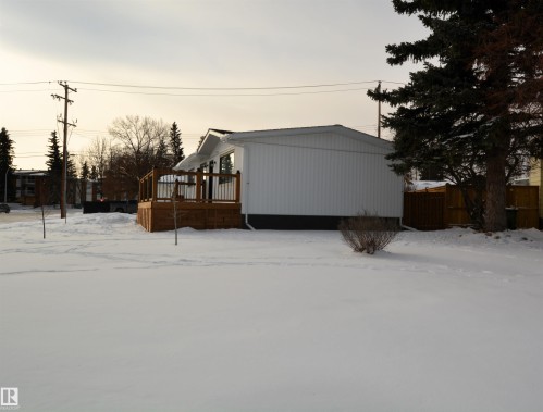 Snow covered property with a deck - 1102 55 Street, Edson, AB - Outdoor