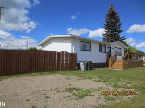 White exterior with black-trimmed windows - 1102 55 Street, Edson, AB 
