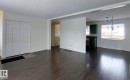 Unfurnished living room with dark wood-style floors - 1102 55 Street, Edson, AB  - Indoor 