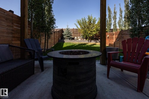 Fenced backyard with a patio and an outdoor fire pit - 1710 Keene Crescent. Sw, Edmonton, AB - Outdoor