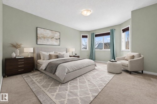 Bedroom with light carpet and a textured ceiling - 152 Rue Marquet, Beaumont, AB - Indoor Photo Showing Bedroom